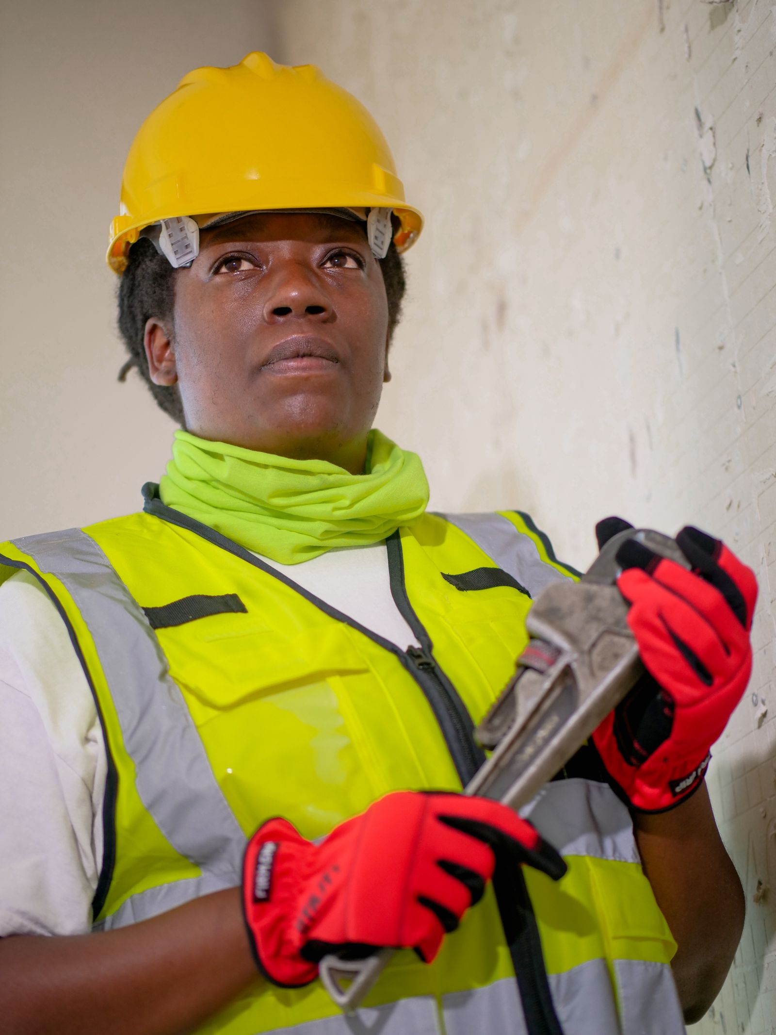 Professional licensed plumber in safety gear ready for a repiping job